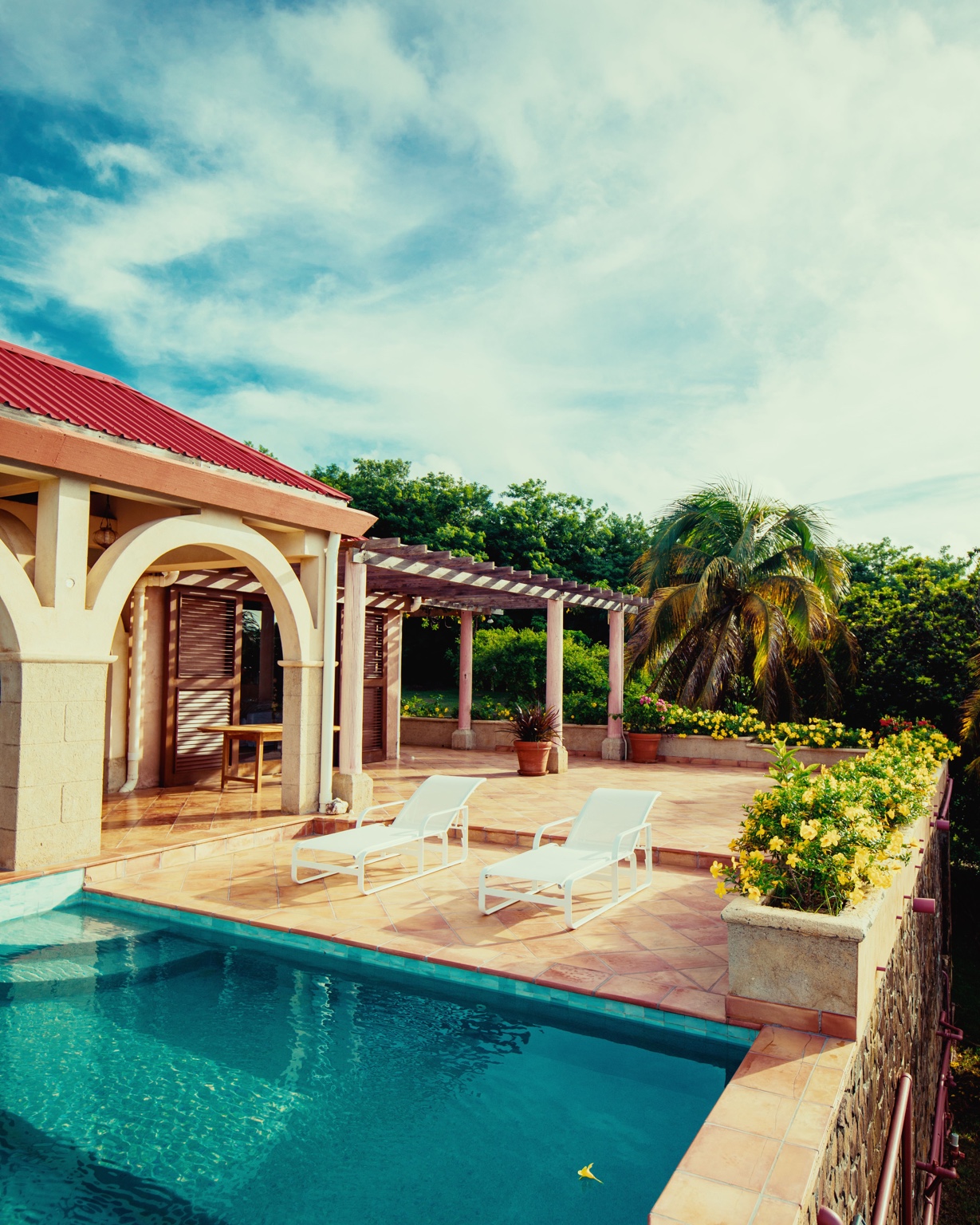 Sunlit Bequia villa terrace with a private pool